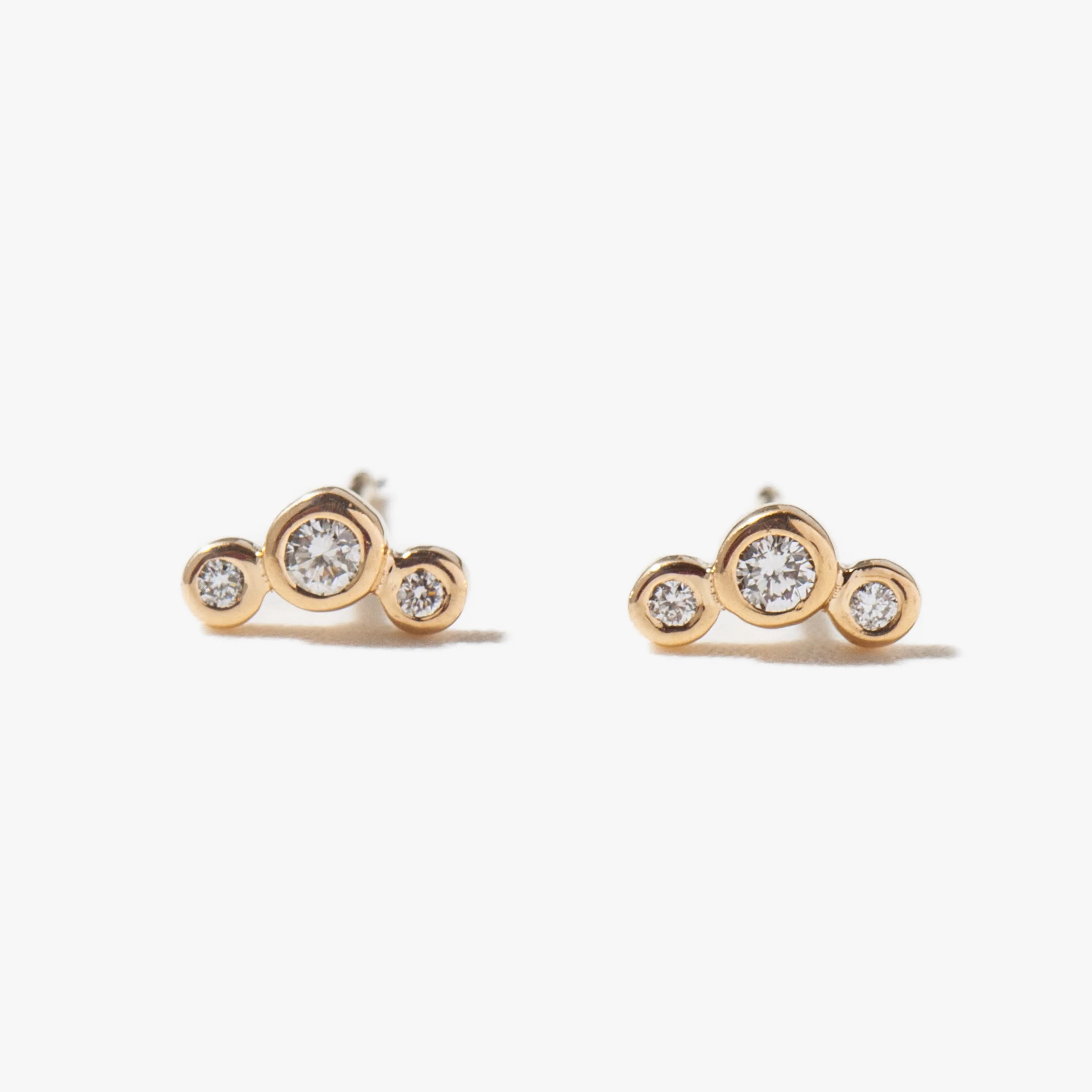 Three Small Graduated Diamond Bezel Studs