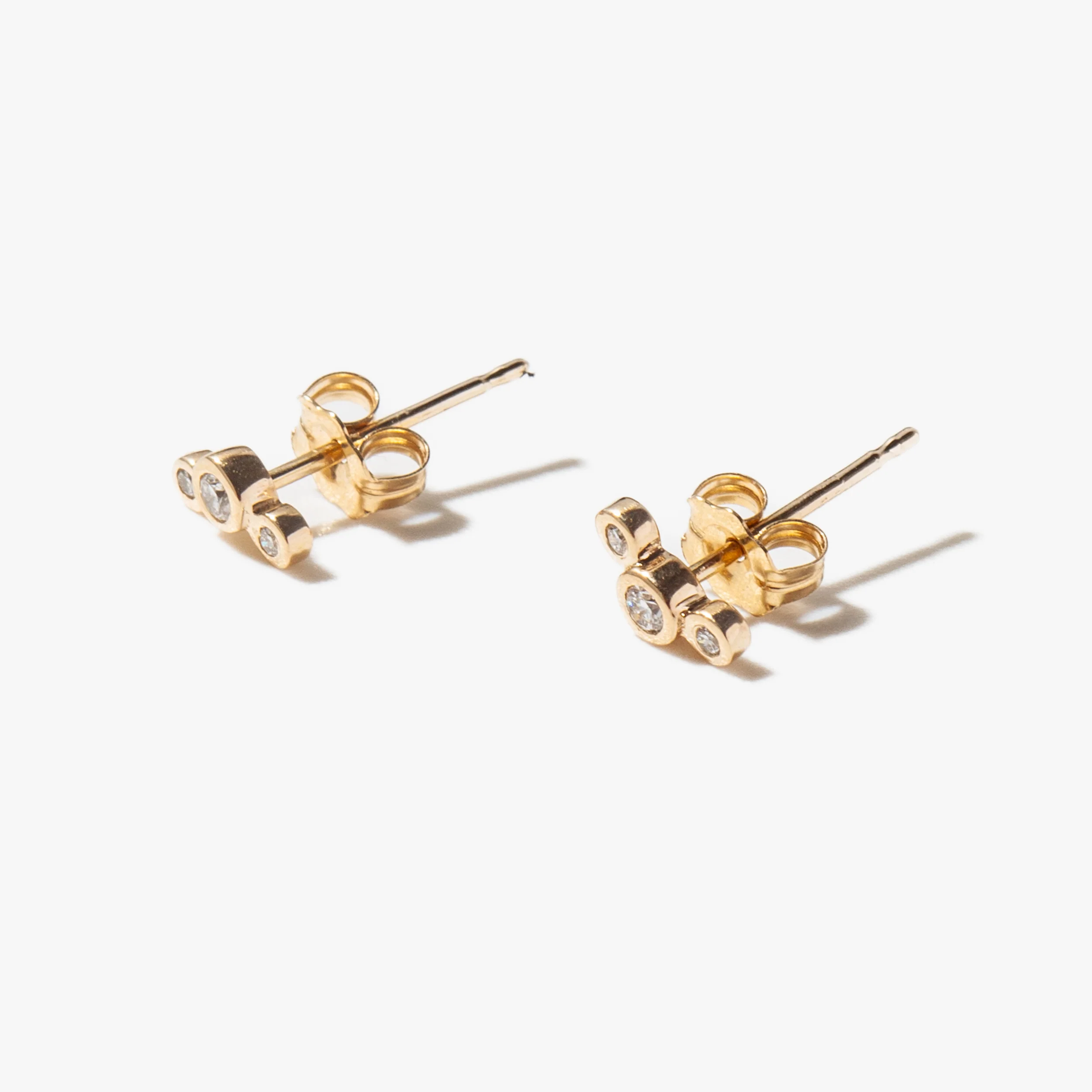 Three Small Graduated Diamond Bezel Studs - Image 3